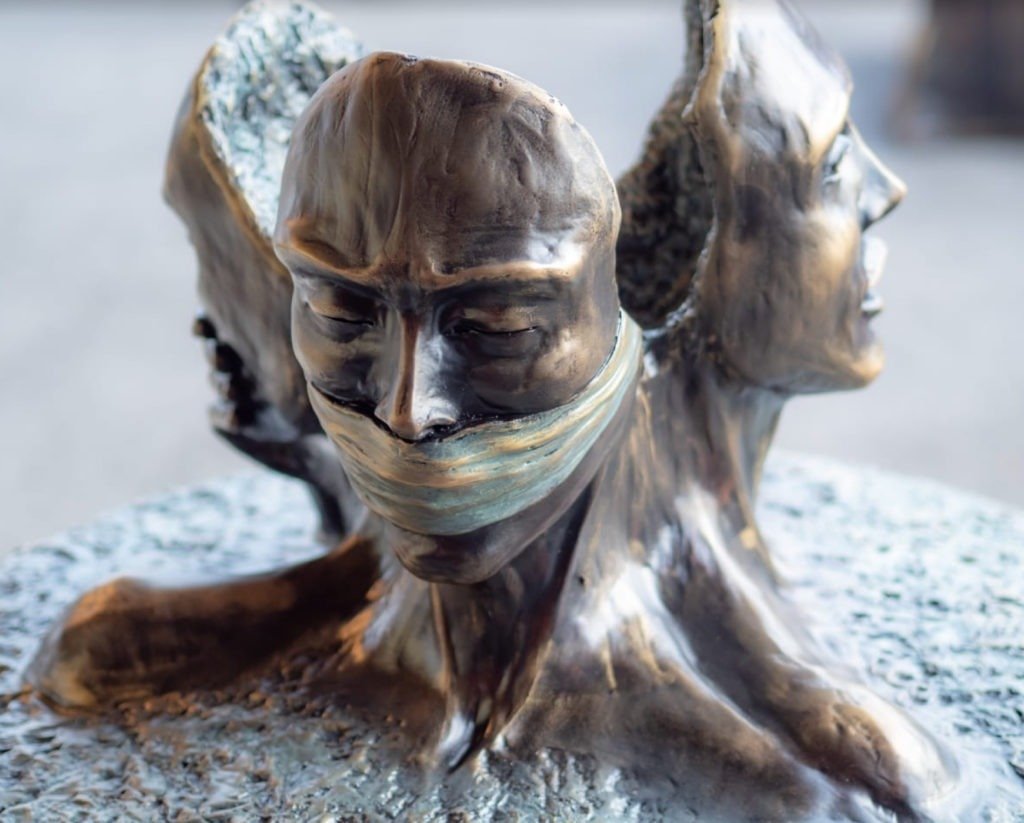 Picture of sculpture of 3 faces